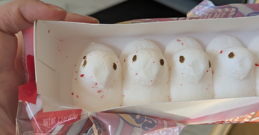 A bunch of white dove-shaped marshmallows that had red specks all over them. 